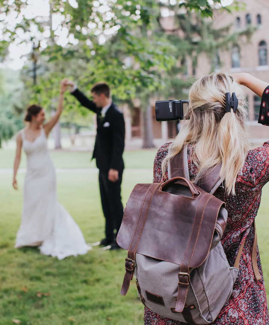 Couple walking through a wedding celebration