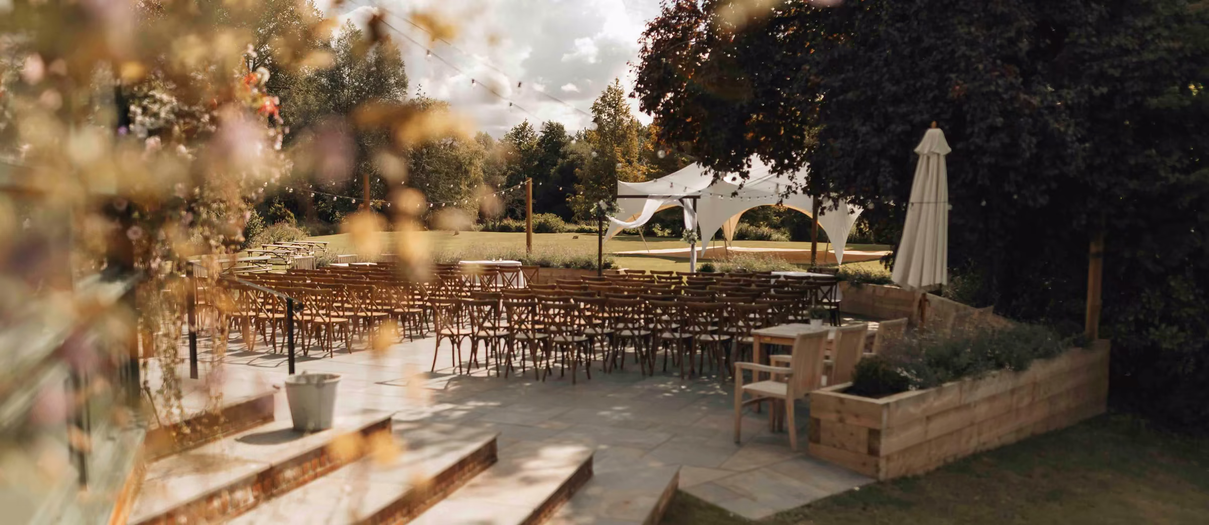 A warmly lit wedding venue prepared for guests
