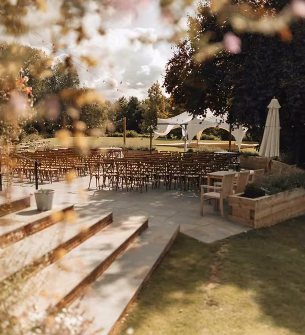 A warmly lit wedding venue prepared for guests